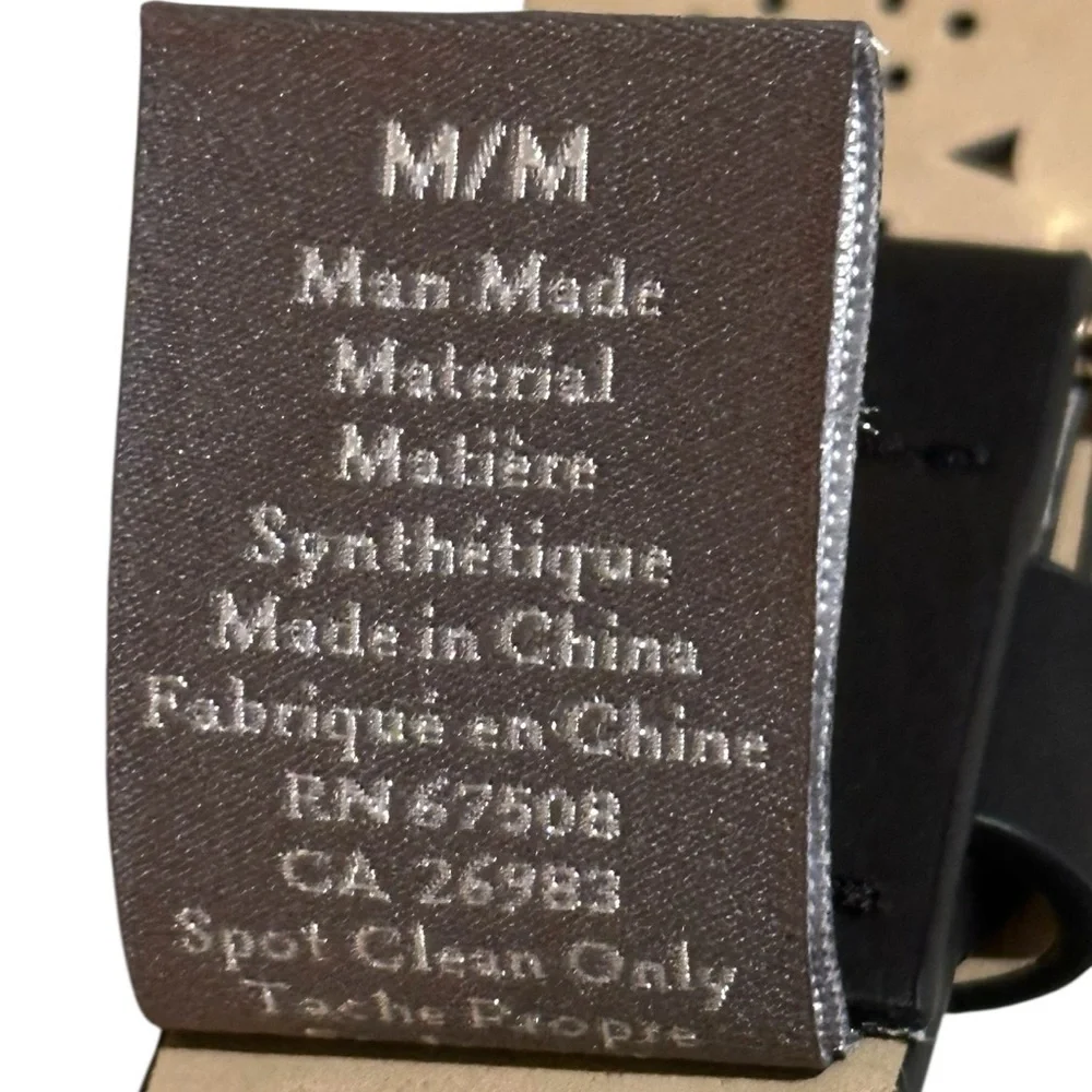 A Vince Camuto black belt with gold Buckle and emblem, size M.
